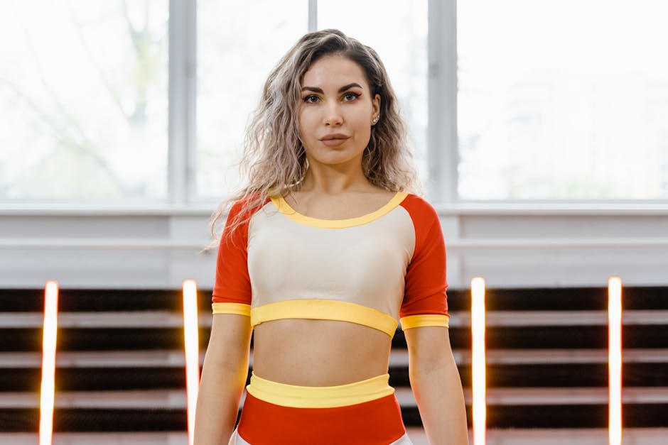 Woman in a strong yoga pose in a bright, modern studio